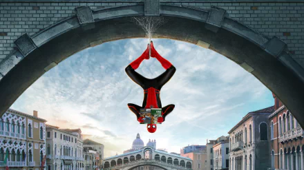 Spider-Man hangs upside down on a bridge in a city, holding a map, in a scene from the movie Spider-Man: Far From Home. HD desktop wallpaper and background.