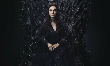 Melisandre (Game of Thrones) seated on the Iron Throne in dark robes, hands folded — 2K Quad HD PC desktop wallpaper/background.