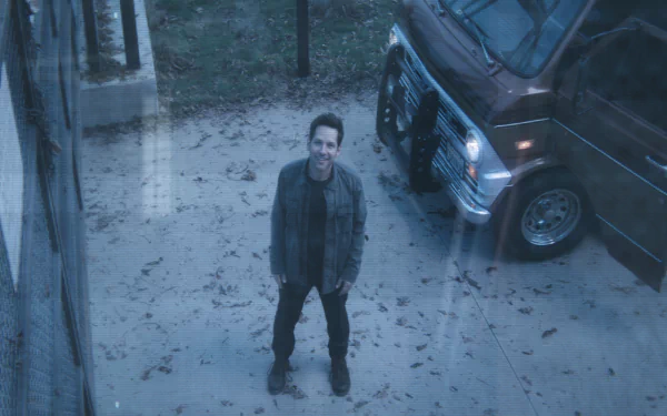 HD desktop wallpaper featuring Paul Rudd as Ant-Man from Avengers Endgame, standing outside next to a van.