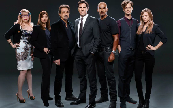 HD desktop wallpaper featuring the main cast of Criminal Minds posing confidently against a dark background.