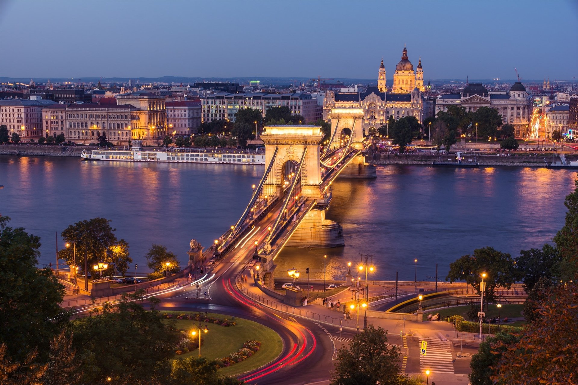 Time-lapse view of the illuminated Chain Bridge spanning the Danube River in Budapest, Hungary, captured as a striking HD desktop wallpaper.