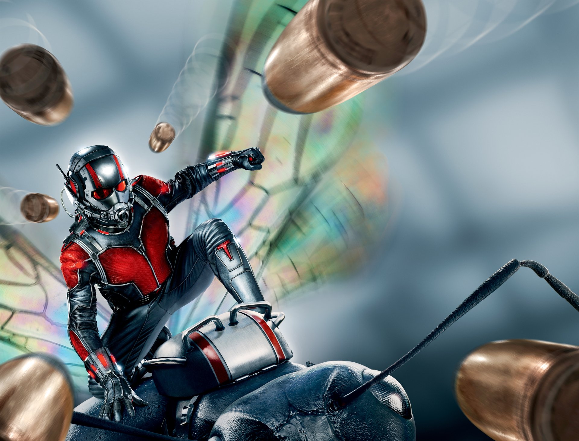 HD desktop wallpaper featuring Ant-Man in his suit, poised for action amidst flying bullets, with iridescent insect wings in the background.
