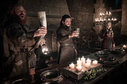 Game of Thrones TV wallpaper: Tormund Giantsbane, Jon Snow and Daenerys Targaryen cheer with cups at a candlelit feast.