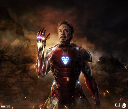 HD desktop wallpaper featuring Tony Stark as Iron Man from the movie Avengers: Endgame, with Stark raising his hand equipped with the Infinity Gauntlet amidst a dramatic background.