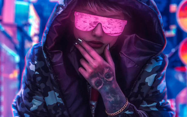 A cyberpunk-themed HD wallpaper depicting a person in a hood, sporting reflective sunglasses and lipstick, with a tattoo on the hand, set against a neon-lit urban backdrop.