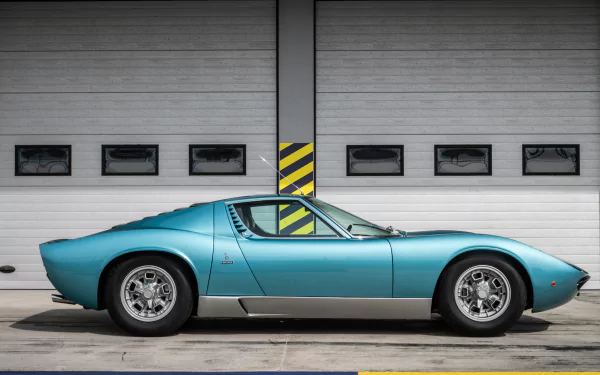 A turquoise Lamborghini Miura supercar parked in front of a modern garage door, featured as a 4K Ultra HD PC desktop wallpaper and background.