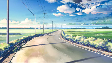 HD anime landscape wallpaper from 5 Centimeters per Second featuring a serene road winding through green fields under a vibrant, cloud-filled sky.