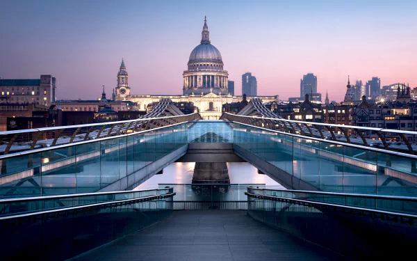 A stunning 8K Ultra HD view of London’s Millennium Bridge at dusk, showcasing the man-made architectural beauty with St. Paul's Cathedral in the background.