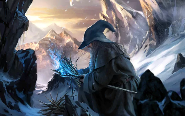 HD desktop wallpaper featuring the wizard Gandalf from The Lord of the Rings. He stands in a snowy, mountainous landscape, holding a glowing blue staff. The scene evokes a magical and fantastical atmosphere.