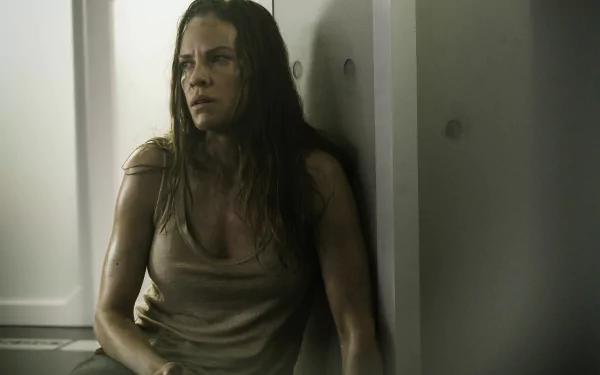 HD wallpaper featuring a scene from I Am Mother with a distressed Hilary Swank in a dimly-lit room.
