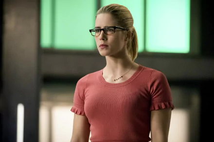 HD desktop wallpaper featuring Emily Bett Rickards as Felicity Smoak from the TV shows Arrow and The Flash (2014), showcasing her signature glasses and focused expression.