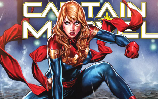 Comic-style HD PC desktop wallpaper of Captain Marvel crouched forward, red sash billowing, star emblem on her chest, vivid colors and dramatic lighting.
