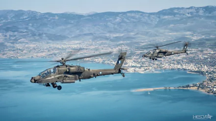 Two Boeing AH-64 Apache attack helicopters fly over a coastal landscape with mountains in the background, captured in an HD desktop wallpaper format.