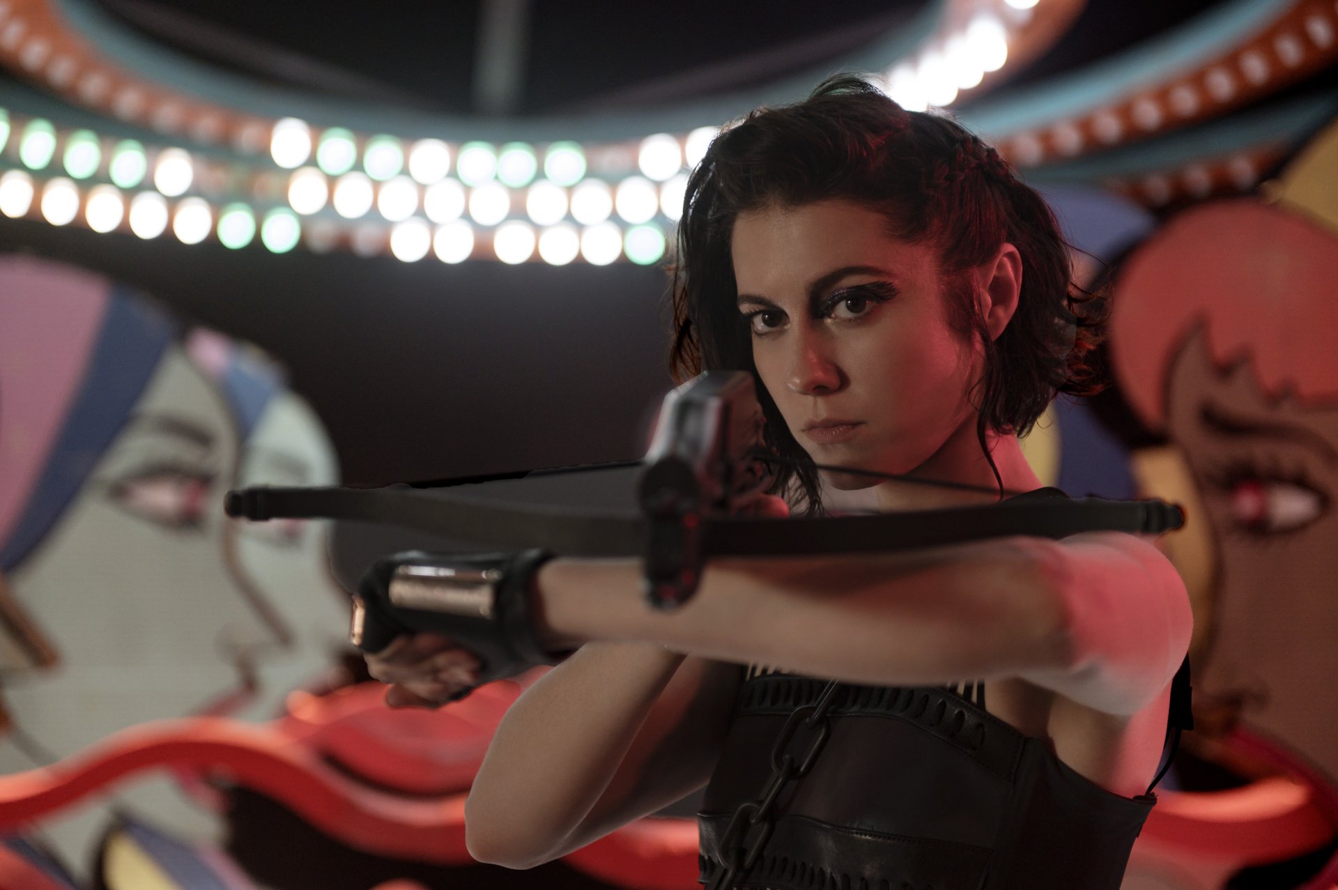 Huntress, portrayed by Mary Elizabeth Winstead in Birds of Prey, aims a crossbow in a dramatic 4K Ultra HD movie wallpaper background.