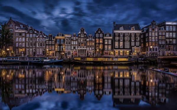 Man Made Amsterdam Cities Netherlands House Canal Boat Night Light Reflection HD Wallpaper | Background Image