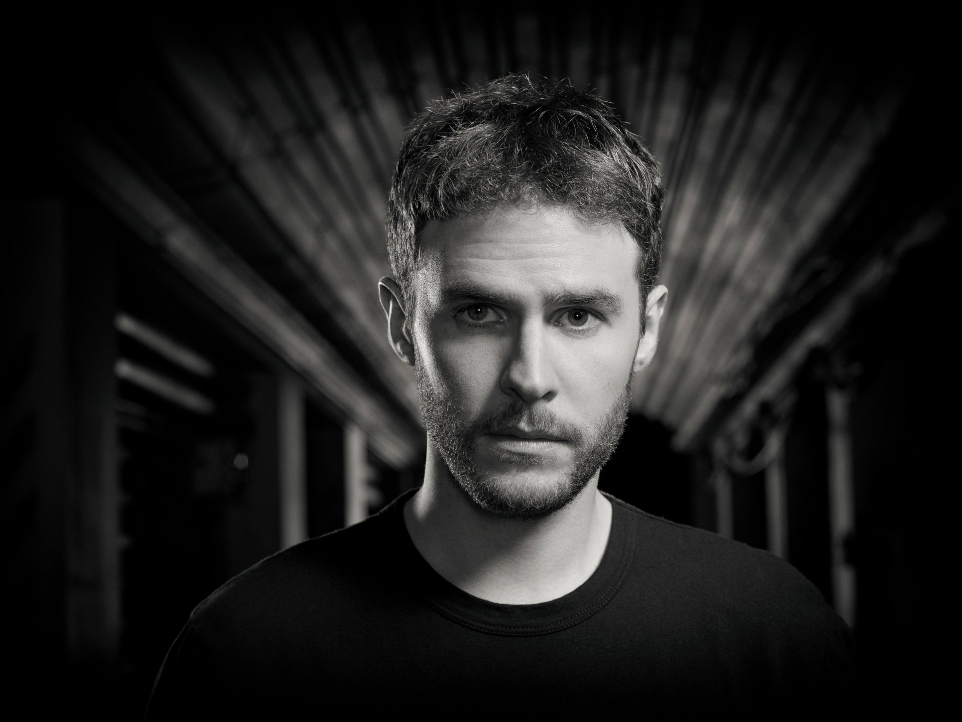 HD PC wallpaper featuring Iain De Caestecker as Leo Fitz from the TV show Agents of S.H.I.E.L.D., captured in a dramatic black and white portrait.