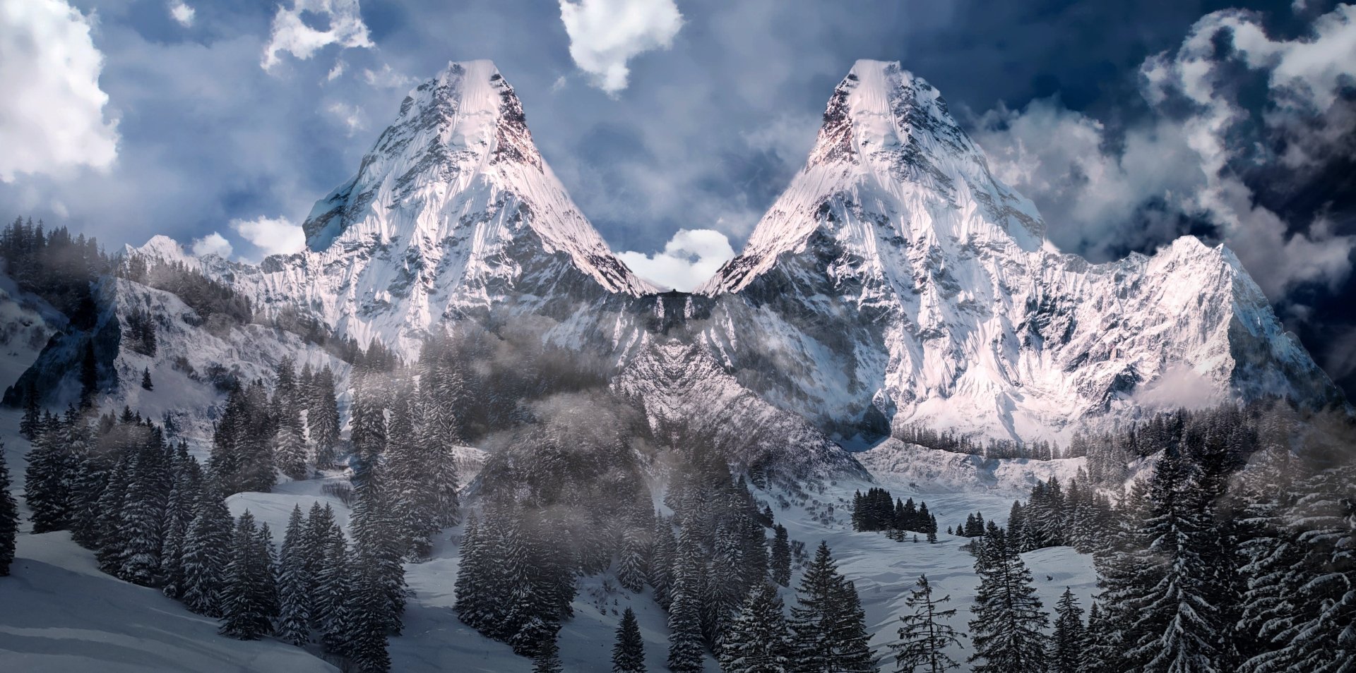 2K Quad HD PC desktop wallpaper and background: snowy nature scene with snow‑capped mountain peaks above a winter forested valley, mist drifting through firs beneath a dramatic cloudy sky.
