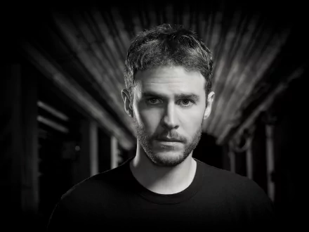 HD PC wallpaper featuring Iain De Caestecker as Leo Fitz from the TV show Agents of S.H.I.E.L.D., captured in a dramatic black and white portrait.