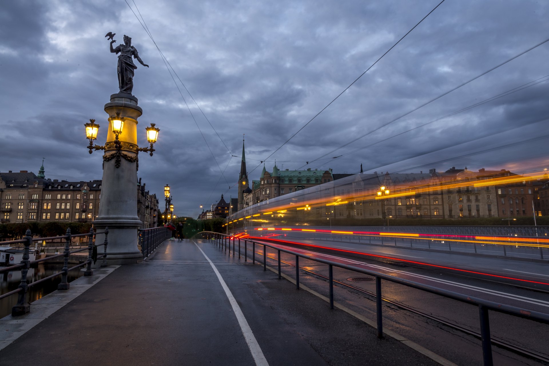 Download Light Sweden Statue Cloud Dusk Road Photography Time Lapse 4k Ultra HD Wallpaper