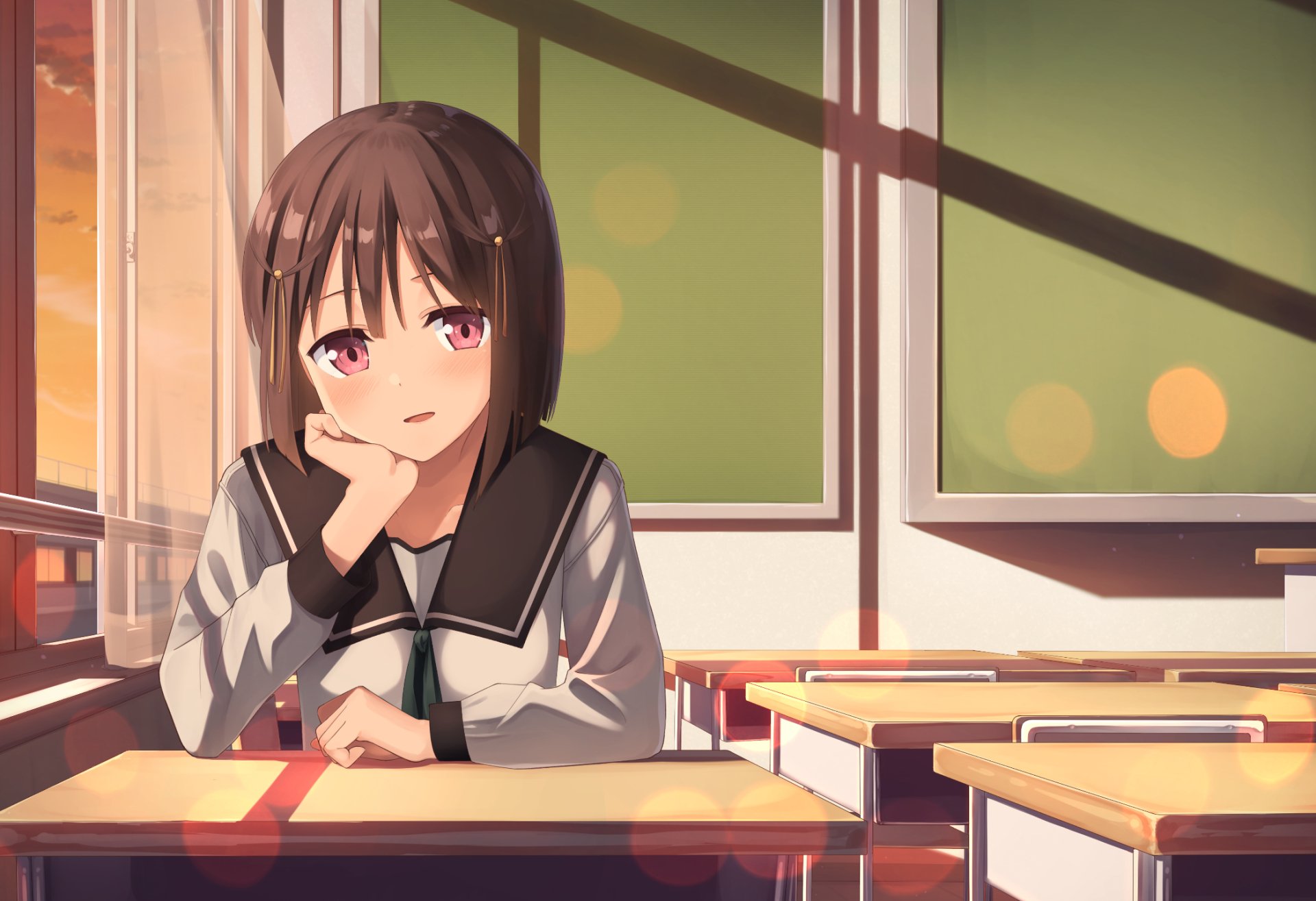 Anime original HD PC desktop wallpaper: short dark-haired schoolgirl with pink eyes resting her chin on her hand at a sunlit classroom desk, warm sunset glow and empty desks behind her.