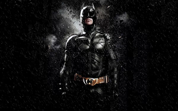 HD PC wallpaper featuring Christian Bale as Bruce Wayne/Batman from the movie The Dark Knight Rises, with a dark, gritty background and dynamic lighting.