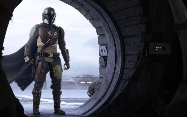 HD PC desktop wallpaper featuring The Mandalorian character from the TV show, portrayed by Pedro Pascal, standing in a circular doorway with a scenic background.