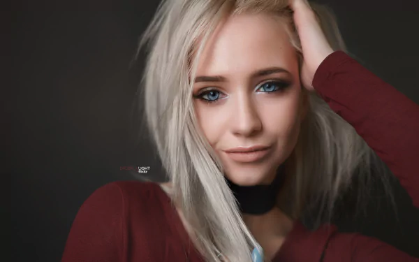 Portrait of a woman with striking blue eyes and blonde hair, captured in 4K Ultra HD as a PC desktop wallpaper featuring model Victoria Zheltyakova.