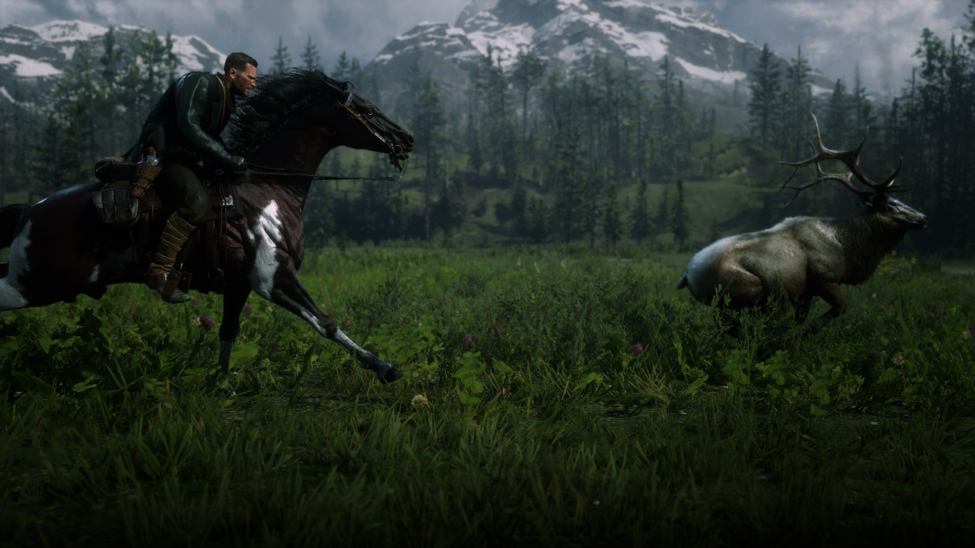 A Red Dead Redemption 2 scene in 4K Ultra HD showing a rider on horseback chasing a stag through a dense forest with mountains in the background.