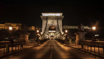 Night view of Budapest’s Chain Bridge, Hungary, illuminated over the Danube River, captured in high definition as a striking PC desktop wallpaper background.