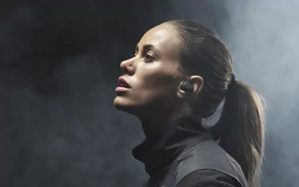 Profile of a brunette woman with a ponytail and earbuds, captured in a moody atmosphere, rendered in 8K Ultra HD for PC desktop wallpaper.