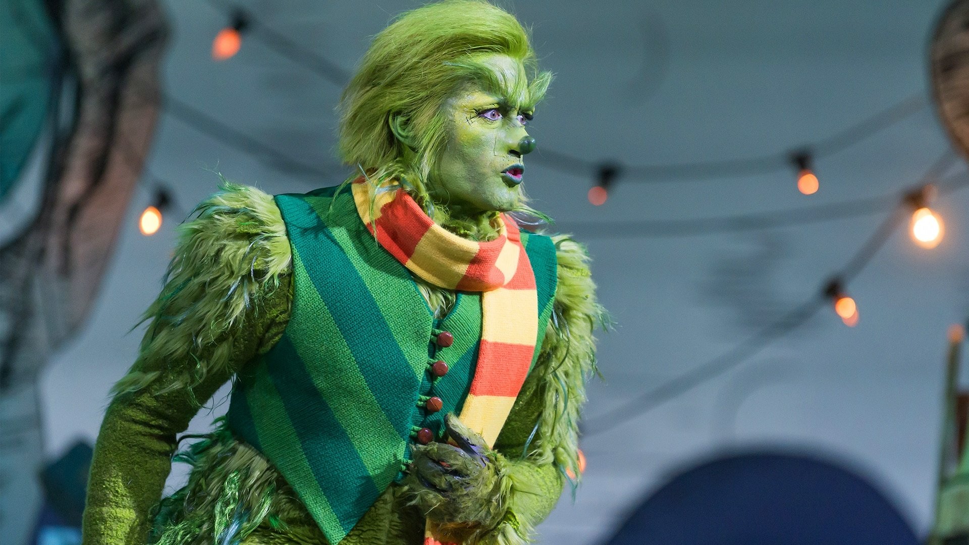 HD desktop wallpaper featuring a performer as The Grinch from Dr. Seuss' The Grinch Musical.