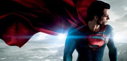 HD wallpaper featuring Henry Cavill as Superman (Kal-El) from the movie Man of Steel, showcasing Superman in his iconic suit with a red cape against a dramatic landscape background.