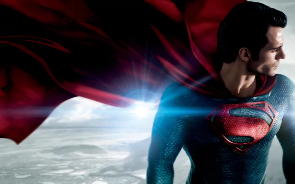 HD wallpaper featuring Henry Cavill as Superman (Kal-El) from the movie Man of Steel, showcasing Superman in his iconic suit with a red cape against a dramatic landscape background.
