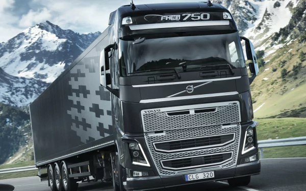 HD desktop wallpaper featuring a Volvo FH16 750 truck traversing a mountainous landscape.