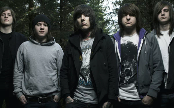 HD desktop wallpaper of the band Bring Me The Horizon standing together in a forested area.