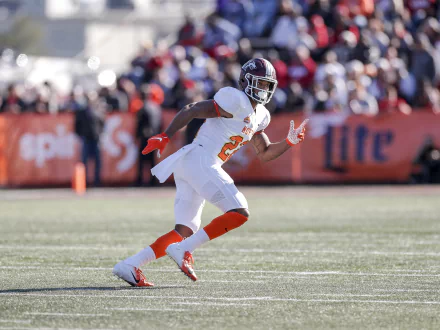 Jeremy Chinn in action during a football game, showcasing his athleticism on the field. A vibrant HD desktop wallpaper capturing the energy of sports.
