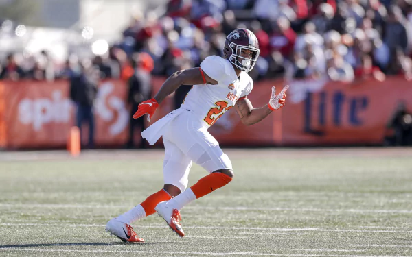 Jeremy Chinn in action during a football game, showcasing his athleticism on the field. A vibrant HD desktop wallpaper capturing the energy of sports.