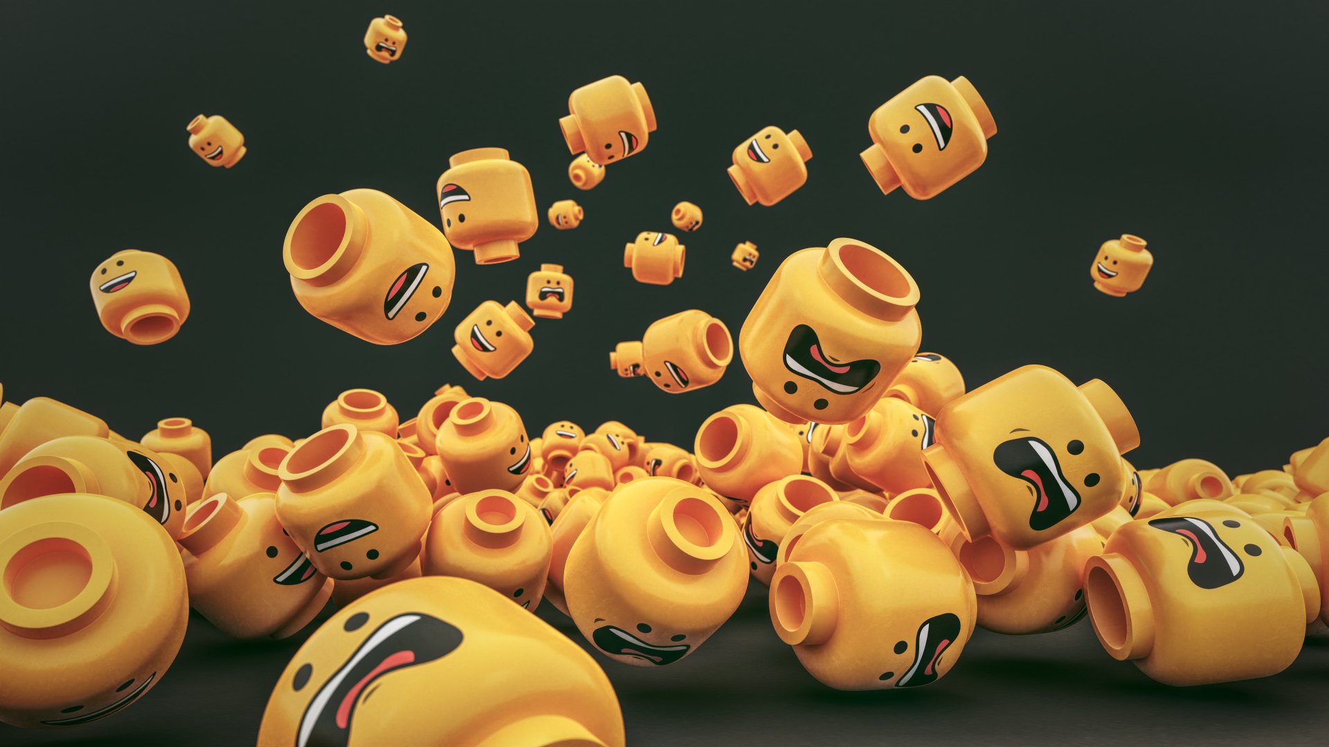 4K Ultra HD PC desktop wallpaper featuring a dynamic cluster of expressive, man-made Lego heads in various emotional states against a dark background.