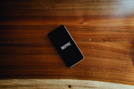  Phone With The Word Inspire On Screen