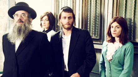 HD desktop wallpaper featuring characters from the TV series Shtisel, poised against an interior backdrop.