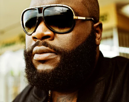 HD desktop wallpaper featuring a close-up of Rick Ross wearing sunglasses.