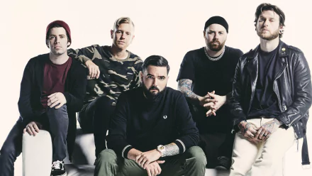 HD wallpaper of the band A Day To Remember, featuring members posing together for a group photo.