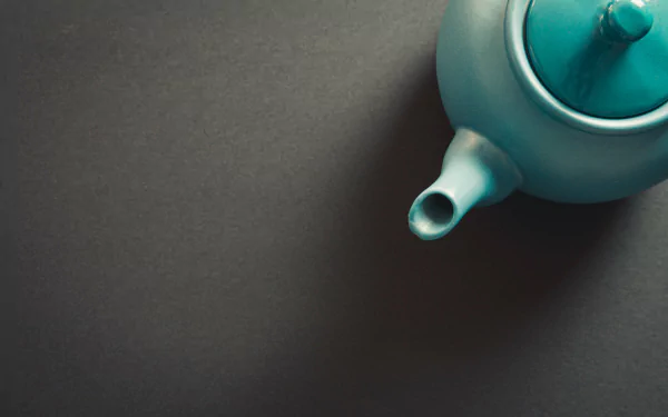  Top View Of A Teapot Against A Grey Background