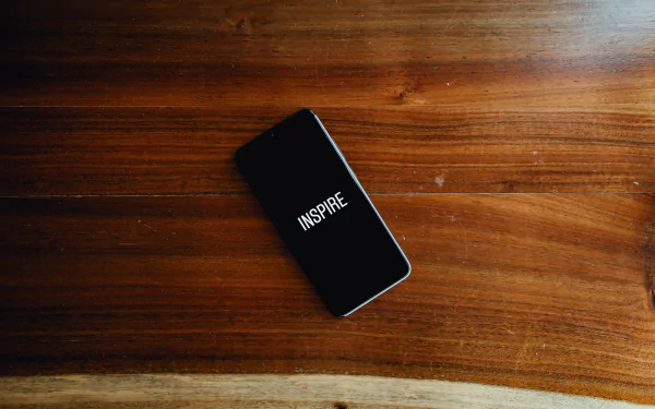  Phone With The Word Inspire On Screen