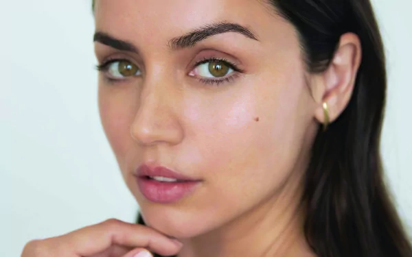 Close-up portrait of Cuban actress Ana de Armas with green eyes and brunette hair, captured in 4K Ultra HD for a PC desktop wallpaper.