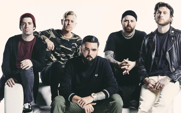 HD wallpaper of the band A Day To Remember, featuring members posing together for a group photo.
