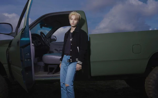 Music-themed 5K Ultra HD PC desktop wallpaper and background tagged ENHYPEN: a young person stands by an open pickup door beneath a cloudy dusk sky.