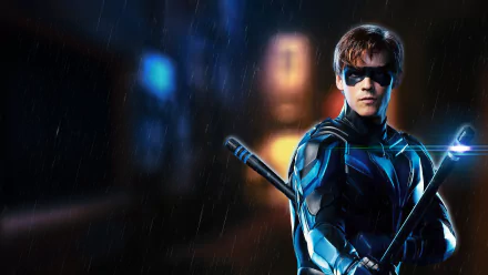 Nightwing (Dick Grayson) from the Titans TV show, armored and masked with escrima sticks in the rain — 4K Ultra HD PC desktop wallpaper/background.
