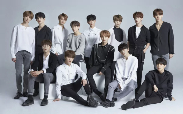 HD desktop wallpaper featuring the K-pop group Seventeen, dressed in coordinated outfits, posing against a neutral background.