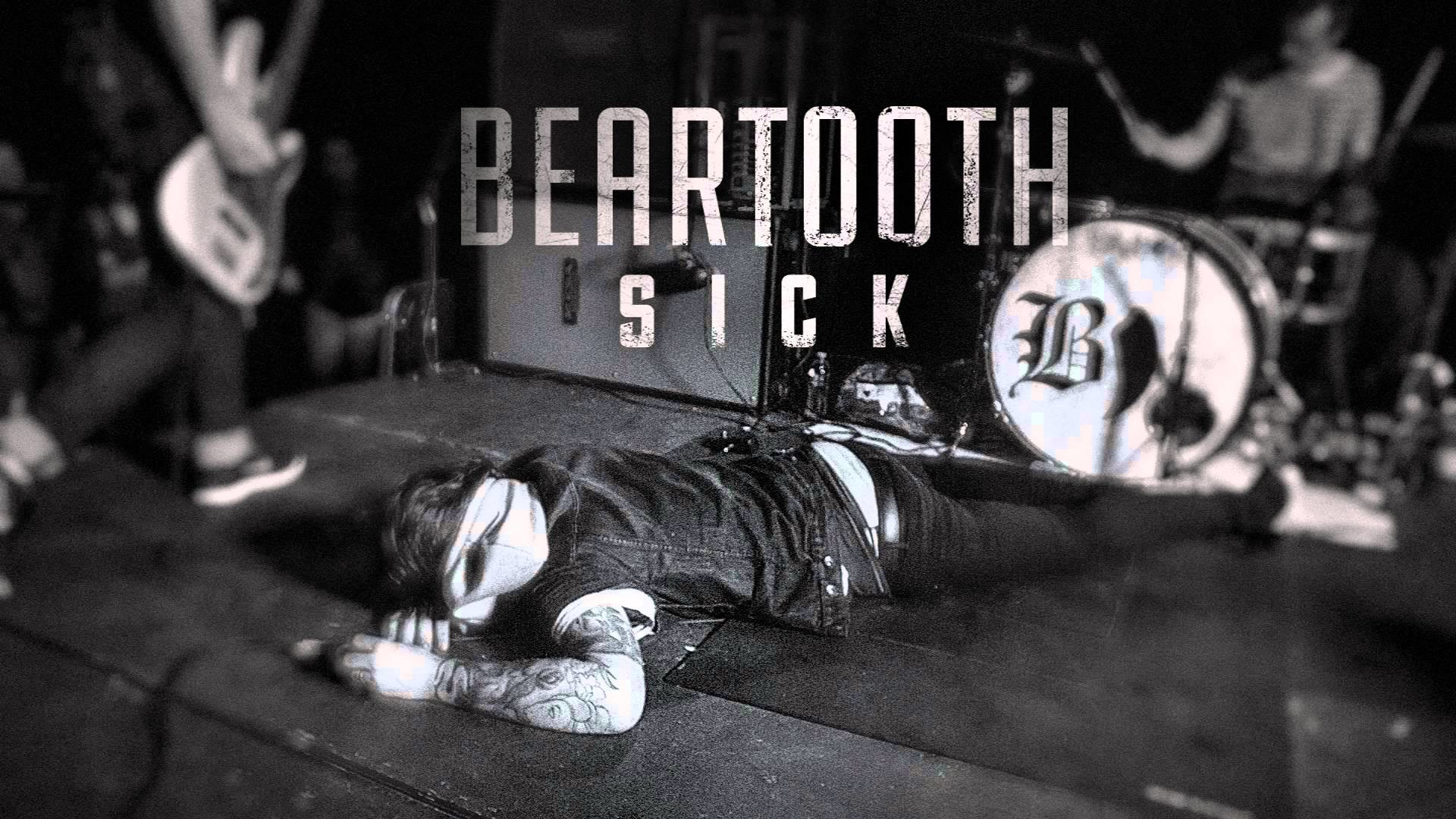 Monochrome HD desktop wallpaper featuring an energetic live performance with the word 'Beartooth' prominently displayed above the band.